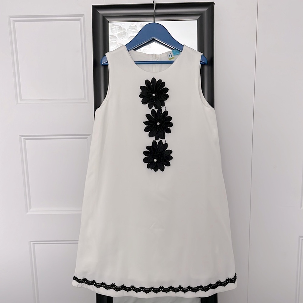 A beautiful, elegant, white and black dress for your young ones!